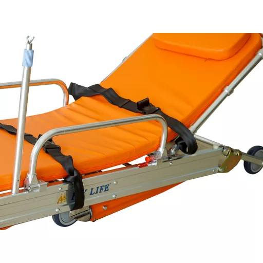 Stretcher with wheels and an automatic folding mechanism